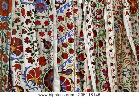 Traditional uzbek suzani embroidery fabrics at oriental bazaar, Bukhara, Uzbekistan