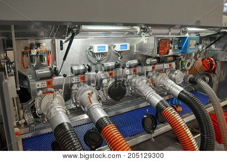 View on truck trailer fuel tank equipment and connected fuelling hoses. Fuelling trailer control board. Fuel tank pump control equipment fuelling process imitation truck trailer equipment compartment