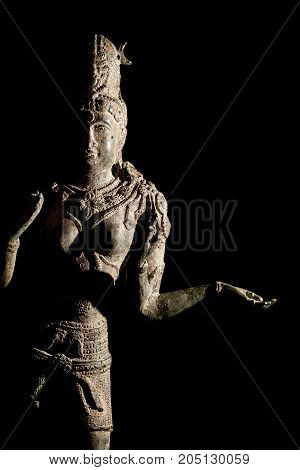 Hinduism religious diety. Traditional Hindu Goddess Lakshmi bronze statue. Black background with copy space.