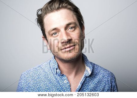 A Portrait of european man isolated over white background. Caucasian male model in studio shoot.