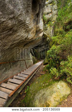 Steps in Unique rocks mountain Adrspasske skaly in national park Adrspach in Czech republic