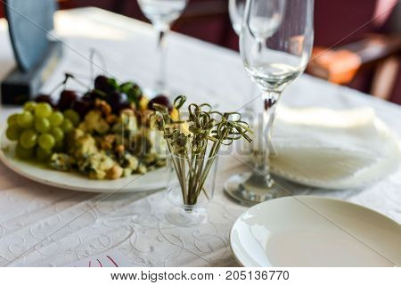 buffet table, Canape, sandwiches, snacks, holiday table, sliced, glasses celebration new year christmas fourchette catering table setting