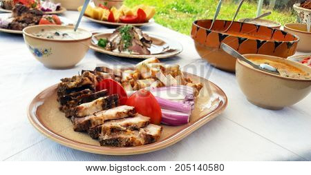 Traditional Romanian pork dish on a outdoor buffet