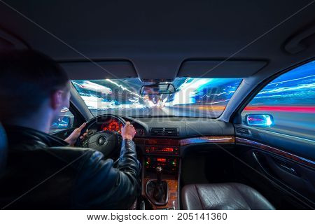 Driver In Car Moves At Fast Speed At Night.