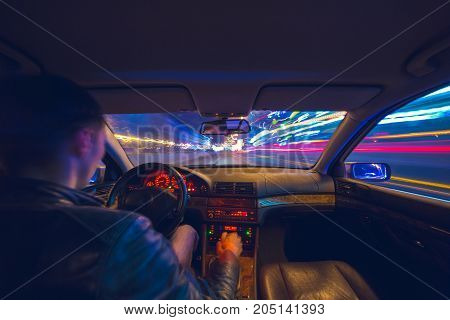 Driver In Car Moves At Fast Speed At Night.