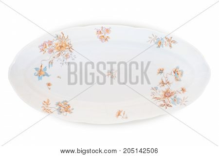 Antique decorated porcelain long plate isolated on white with clipping path. Porcelain factory of Kornilov brothers end of 19th century St Petersburg. New rococo decal