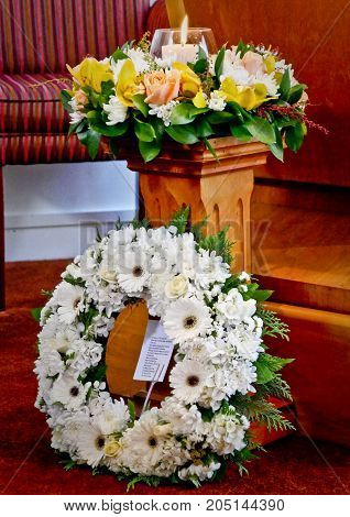 Shots of flowers & candles for funeral service