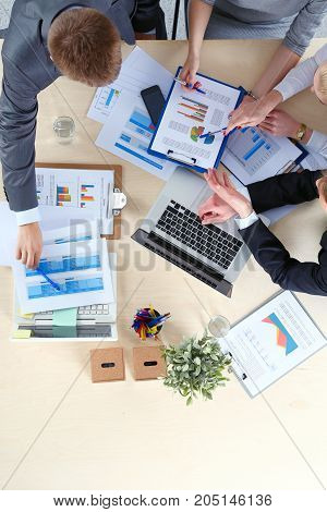 Business people sitting and discussing at business meeting. Business people