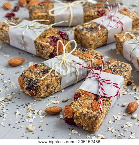 Homemade granola energy bars with figs oatmeal almond dry cranberry chia and sunflower seeds square format