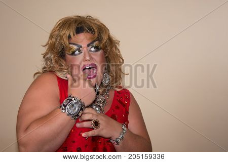 Funny travesty actor. Drag queen. Fat man and make-up.