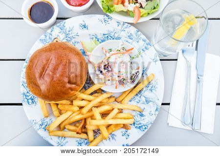 Burger And Chips With Coleslow Salad