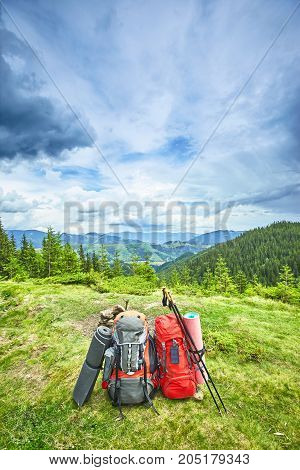 Backpacks in the mountains with views of the mountains.