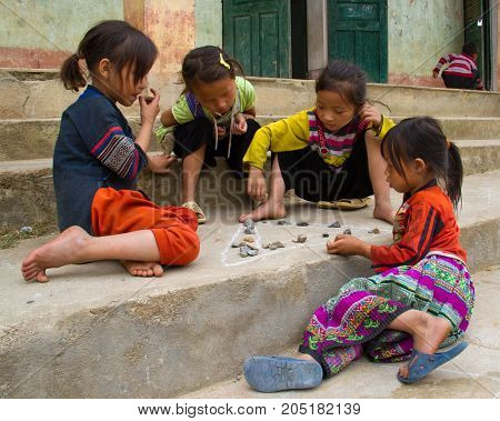 Children Play Game With Chalk And Rocks In North Vietnam