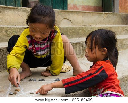 Children Play Game With Chalk And Rocks In North Vietnam