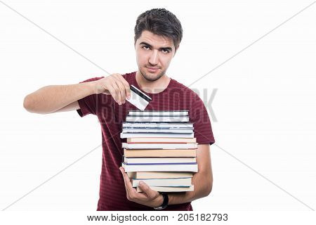 Student Holding Pile Of Books And Credit Card