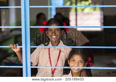 PONDICHERY PUDUCHERY INDIA - SEPTEMBER 04 2017. Unidentified child at schhol behind the window