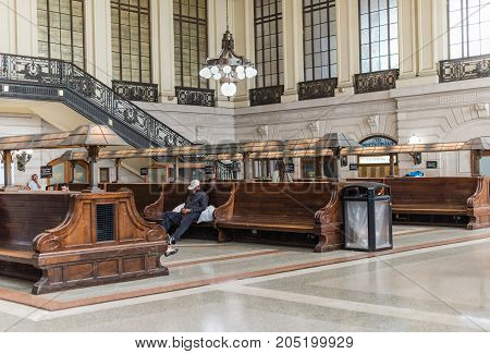 Hoboken NJ USA -- September 19 2017 The waiting room for the Hobaoken train station. A man is alseep on one of the benches. Editorial Use Only.