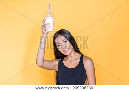 Asian Woman Holding Milkshake