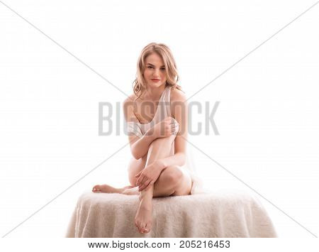 pretty sexy young bare blond woman portrait in studio on isolated white background