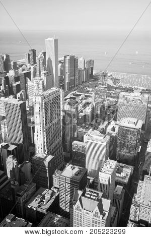 Chicago skyline and lake Michigan. An overhead view of the great city of Chicago downtown taken from the Willis (Sears) Tower. Vertical composition in black and white.