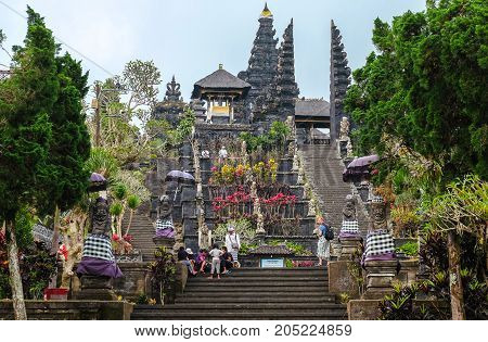 Besakih Indonesia - September 9 2017: Visitors explore the immense Pura Besakih Temple (Royal Temple of Besakih). the most important temple and holiest Hindu temple in Bali.