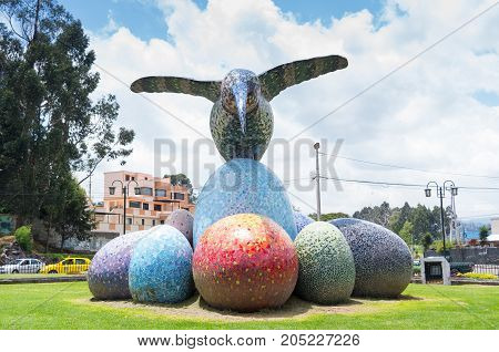 Quito, Ecuador - 28 APRIL, 2015 Historic monument of a huge colorful hummingbird sculpture located in the valley of Los Chillos.