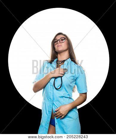 Sexy female doctor with stethoscope on a white circle and black background.
