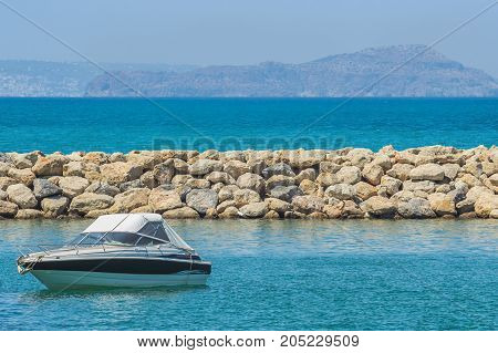 White cabin cruiser over blue water. A luxury private motor yacht under way on Black Sea sea
