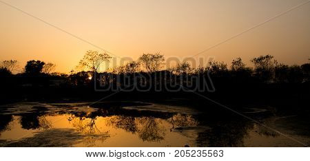 Sunset over a creek, reflects the beautiful sky