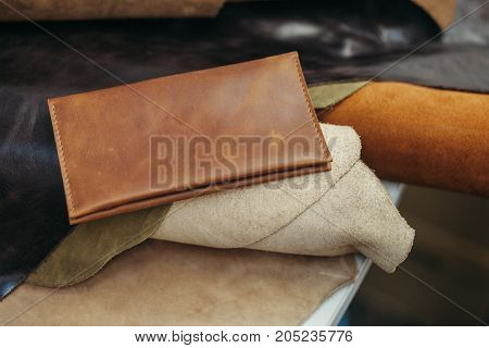 Purses in different styles which made from colorful genuine leather.
