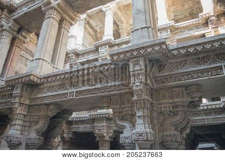 Fine carved design of 18th century on a wall of Adalaj steps well or Waav