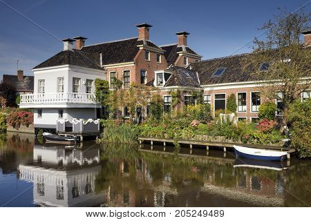 The village Onderdendam on the Boterdiep canal in the Dutch province Groningen