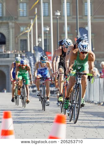 STOCKHOLM - AUG 26 2017: Back of group of colorful triathlete cyclists in the Men's ITU World Triathlon series event August 26 2017 in Stockholm Sweden