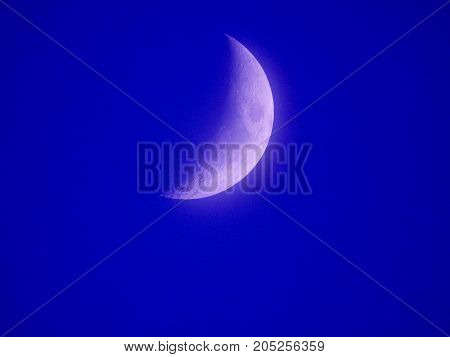 Photo of moon phase catching craters on it's surface