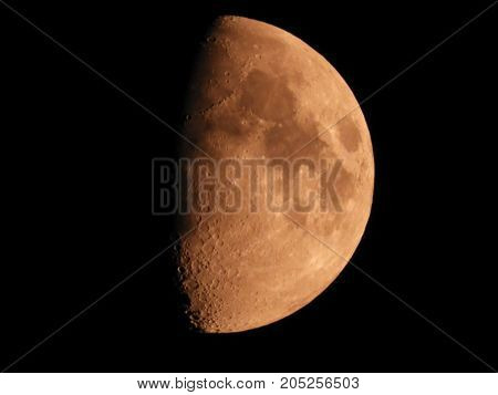 Photo of moon phase catching craters on it's surface
