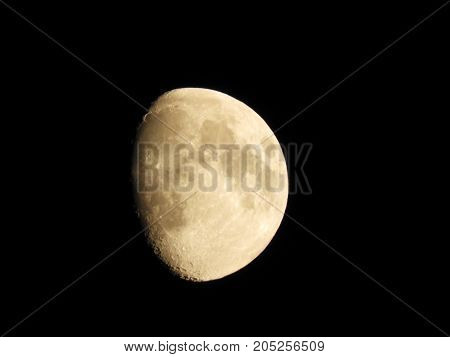 Photo of moon phase catching craters on it's surface