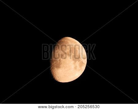 Photo of moon phase catching craters on it's surface