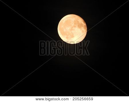 Photo of moon phase catching craters on it's surface