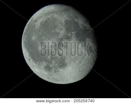 Photo of moon phase catching craters on it's surface