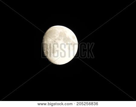 Photo of moon phase catching craters on it's surface