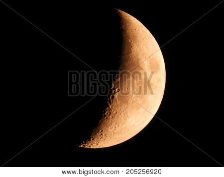 Photo of moon phase catching craters on it's surface