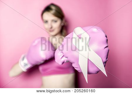 A Fight for Breast Cancer woman with symbol on pink background