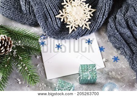 christmas greeting card with christmas decorated with cones green branches fir trees on gray concrete background copy space.new year