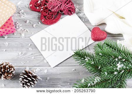 Christmas flat lay styled scene with evergreen tree twigs Christmas decorations on a gray concrete background and copy space
