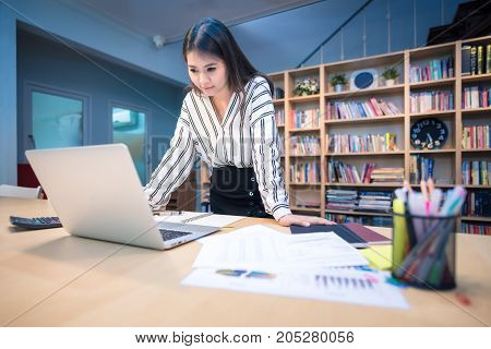 Young Asian Business Entrepreneur Working With Big Data Analysis On Smart Computer At Home Office.co