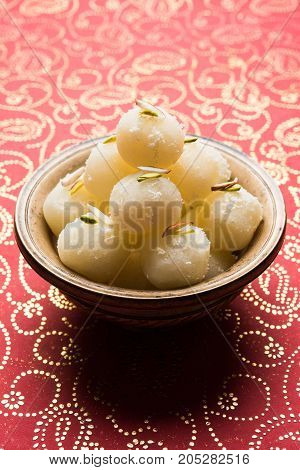 Stock Photo of Rasgulla or sponge Ras Gulla, It is made from ball shaped dumplings of chhena and semolina dough, cooked in light syrup made of sugar.