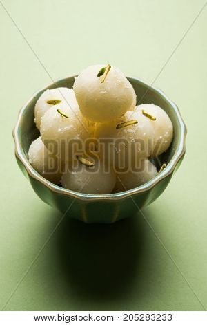 Stock Photo of Rasgulla or sponge Ras Gulla, It is made from ball shaped dumplings of chhena and semolina dough, cooked in light syrup made of sugar.