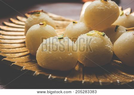 Stock Photo of Rasgulla or sponge Ras Gulla, It is made from ball shaped dumplings of chhena and semolina dough, cooked in light syrup made of sugar.