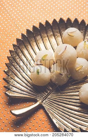 Stock Photo of Rasgulla or sponge Ras Gulla, It is made from ball shaped dumplings of chhena and semolina dough, cooked in light syrup made of sugar.