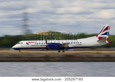 LONDON UK - AUGUST 2 2013; A Bristish Airways Saab 2000 (G-CDEB) take off from London City Airport